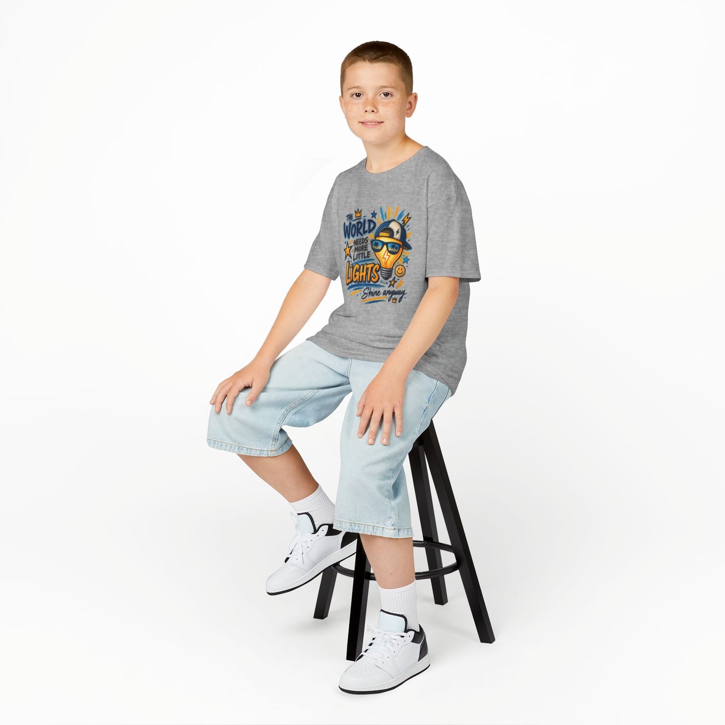 Kids T‑Shirt — "The World Needs More Little Lights" Cute Sunglasses Lightbulb Graphic